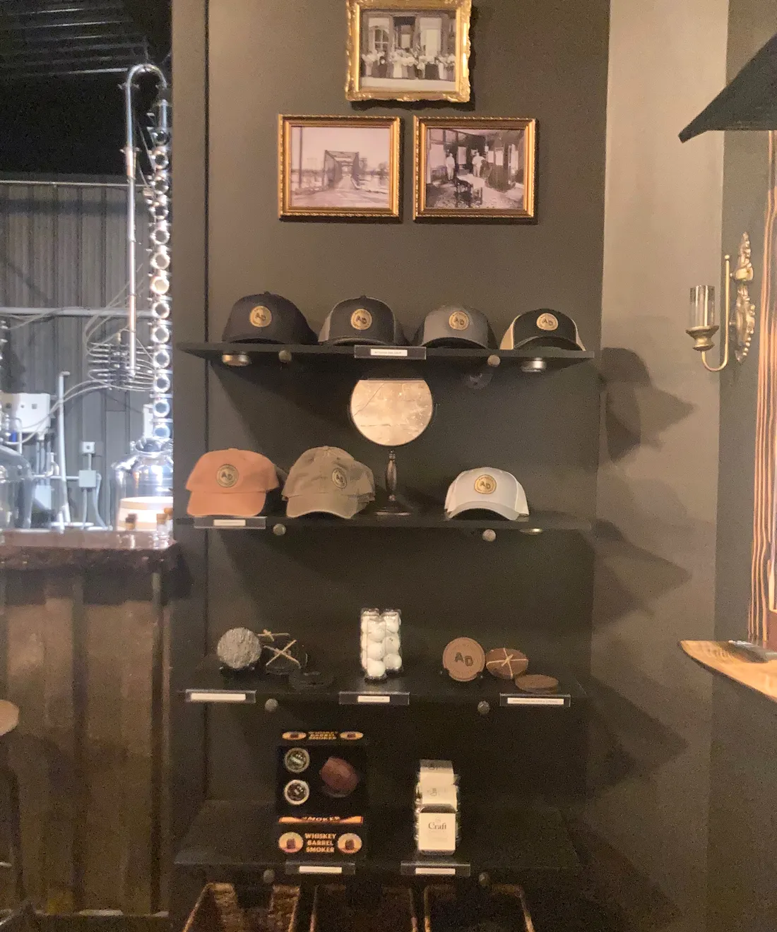 Embroidered Antwerp Distillery caps and coasters on display